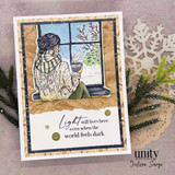 Card with the window scene over kraft, 'light still lives here even when the world feels dark.'