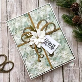 Card of a gold bow on snowy patterned paper with a white poinsettia and 'Just for you.'