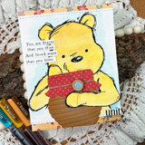 Bear cradling a kraft honey pot on a hand-painted blue watercolor panel, with the sentiment "You are braver than you think. And loved more than you know."