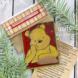 Bear on a deep-red plaid-and-pine Christmas card, with the sentiment "Family & friends are the truest joys of Christmas."