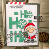 A cardmaking project featuring a chubby, cheerful cartoon Santa holding pine sprigs from Unity Stamp Co's A Little Ho Ho Ho red rubber stamp set, with the sentiment 'Merry Christmas'.