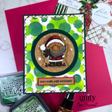 A handmade greeting card with a chubby, cheerful cartoon Santa holding pine sprigs from Unity Stamp Co's A Little Ho Ho Ho red rubber stamp set, with the sentiment 'Special delivery from the North Pole'.