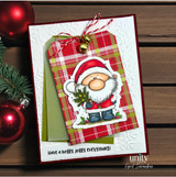 A colored card featuring a chubby, cheerful cartoon Santa holding pine sprigs from Unity Stamp Co's A Little Ho Ho Ho red rubber stamp set, with the sentiment 'You're on the nice list'.