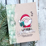 A stamped card showcasing a chubby, cheerful cartoon Santa holding pine sprigs from Unity Stamp Co's A Little Ho Ho Ho red rubber stamp set, with the sentiment 'Ho Ho Ho'.