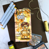 Tall tag card with the hen in golden tones over an ink-blended brick wall with yellow twine and the I'm not bossy, I just have much better ideas sentiment, staged with markers and inks.