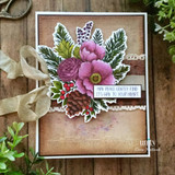 Sample card with the winter bouquet colored in plum and magenta, die cut and layered over a soft script background with lace and a wide ribbon bow.