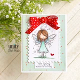 White scalloped card with the fairy in a mint dress, a big red polka-dot bow, and 'Have a fairy wonderful birthday' beneath her.