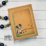 Kraft card of a single dachshund puppy in a soft spotlight, 'just a hello'.