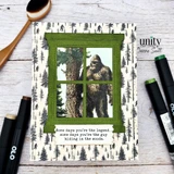 Card with the Sasquatch framed inside a green die-cut window over Bigfoot-print paper, with a humorous sentiment strip below.