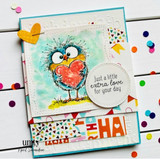 Bright confetti card with the bird holding a pink heart and 'Just a little extra love for your day.'
