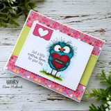 Pink card with the bird holding a red heart and 'Just a little extra love for your day.'
