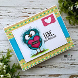 Colorful card with the teal bird holding a red heart and 'LOVE. just because.'