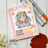 Handmade card made with Unity Stamp Co’s The Softest Thoughts red rubber stamp set — a fluffy bunny in a knit beanie hugging a heart, with a snowflake — stamped and colored, with the sentiment “a little reminder that you're pretty wonderful”.
