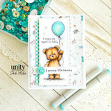 Card of the teddy with a teal balloon over stars reading "A brand new heart to hold."