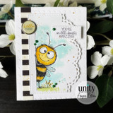 A stamped card showcasing a wide-eyed, smiling cartoon bumblebee from Unity Stamp Co's Peek-A-Bee red rubber stamp set, with the sentiment 'Hey honey'.