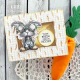 Handmade sample card using the Where Little Gardens Grow papers — a pencil-sketched gray bunny wearing glasses in a frame, paired with carrot-print paper and a felt carrot accent.