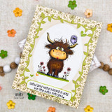 A stamped card showcasing a shaggy Highland cow with a little bird perched on its head, in a wildflower meadow from Unity Stamp Co's Seen & Herd red rubber stamp set, with the sentiment 'Hay thanks!'.