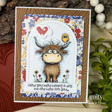 A stamped card showcasing a shaggy Highland cow with a little bird perched on its head, in a wildflower meadow from Unity Stamp Co's Seen & Herd red rubber stamp set, with the sentiment 'Hay thanks!'.
