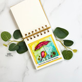 Spiral notepad card with the bird under an umbrella and 'When in doubt, bring your own sunshine.'