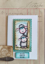Card with the peeking sheep on a small panel over ledger paper and 'We just came for the cake.'