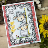 Ornate lace-print card with the two sheep and 'You've been on our minds.'