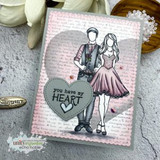 A blush script background card with the couple colored in soft pink and grey, beside a grey die cut heart stamped 'you have my HEART'.