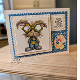 A colored card featuring a nerdy bunny in big round glasses and denim overalls, surrounded by books from Unity Stamp Co's Clever Cottontail red rubber stamp set, with the sentiment 'Here's to your success'.