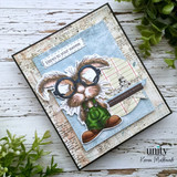 A colored card featuring a nerdy bunny in big round glasses and denim overalls, surrounded by books from Unity Stamp Co's Clever Cottontail red rubber stamp set, with the sentiment 'Think BIG, dream BIGGER'.