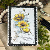 Card with the flower spray in golden yellow on a black scalloped frame and 'Beautiful things take time.'