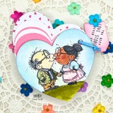 Card of the kissing couple over a blue heart with "The best love stories never end."