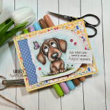 Card with the puppy over confetti paper and a butterfly, 'Just when you need it most... hope appears.'