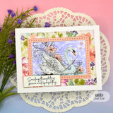 Swan sympathy card with floral background and “peace and sympathy” sentiment.