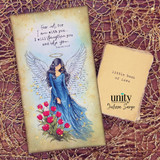 Handmade card featuring a graceful angel with outstretched wings and halo in a flowing blue gown, surrounded by florals and gold splatter, with the scripture “Fear not, for I am with you… I will strengthen you and help you.”