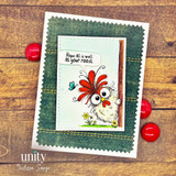 Handmade card featuring a whimsical chicken stamp peeking from behind a post, with “Hope all is well at your roost” sentiment, set on a green stitched background with rustic wood backdrop.