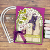 Bleeding heart floral card with a purple hummingbird, ribbon bow, and the sentiment “Soft doesn’t mean weak.”