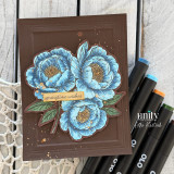 Blue floral card with “springtime wishes” sentiment on a dark brown background with gold splatter accents.
