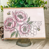 Handmade floral card with blush pink flowers, bees, vintage script, and honeycomb background accents.