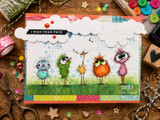 Whimsical bird card with five colorful fluffy birds under clouds and the sentiment “I MISS YOUR FACE.”