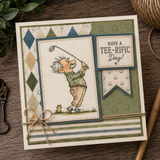 Sample card using the pack: green and argyle papers behind the cartoon golfer panel, finished with a pointed flag banner reading have a tee-rific day.