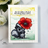 Friendship card with skunk holding red flower and “always stays in bloom” sentiment.