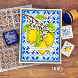 Handmade lemon-themed card with blooming citrus branches on a blue tile background and the sentiment, "Explore Dream Discover."
