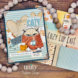 Humorous get well card with a grumpy blanket-wrapped cat, “Stay Cozy” sentiment, and cozy café-themed paper accents.