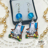Ghost-in-a-beach-chair dangle earrings with blue sea-glass beads and silver hooks.