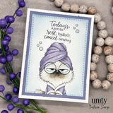 Card of the cat in a lavender towel with purple berries alongside.