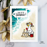 Beach-themed card with a sunhat-wearing goose building a sandcastle and the sentiment, “Soak up the Sunshine!”
