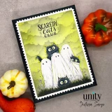 Halloween card with the ghost-cats scene colored on a green cloudy-sky background beside little pumpkins, stamped 'Scaredy Cats Club.'