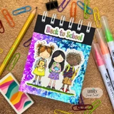 Back-to-school card with three little students in a row carrying backpacks and notebooks under a colorful 'Back to School' banner.
