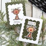Two Christmas cards on dark green star paper, each framing a little character tangled in colorful twinkle lights inside a white scalloped die cut.