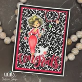 Card featuring the Heard There's a Party?! red rubber stamp set: a glamorous blonde in a red dress with a speech bubble beside bold red 'Congrats' lettering, on a black-and-white patterned panel.