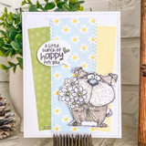 Handmade card with stitched panels of green, daisy-print blue and yellow paper, the scruffy Sniffs & Stems dog holding a bunch of white daisies below a speech-bubble sentiment, 'A little bunch of happy for you.'